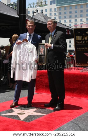 LOS ANGELES - JUN 2:  Bobby Flay presenting Leron Gubler with MESA Grill chef jacket for future WOF museum at the Bobby Flay Hollywood WOF Ceremony on Hollywood Blvd on June 2, 2015 in Los Angeles, CA