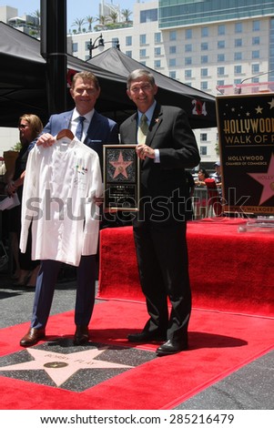 LOS ANGELES - JUN 2:  Bobby Flay presenting Leron Gubler with MESA Grill chef jacket for future WOF museum at the Bobby Flay Hollywood WOF Ceremony on Hollywood Blvd on June 2, 2015 in Los Angeles, CA