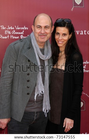 LOS ANGELES - MAR 13:  John Varvatos, Joyce Varvatos arriving at the John Varvatos 8th Annual Stuart House Benefit at John Varvaots Store on March 13, 2011 in Los Angeles, CA
