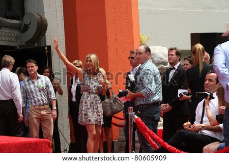 LOS ANGELES - JUL 7:  Jennifer Aniston, Justin Theroux (White shirt, black tie and hair) at the Jennifer Aniston Handprint & Footprint Ceremony at Grauman\'s Chinese on July 7, 2011 in Los Angeles, CA