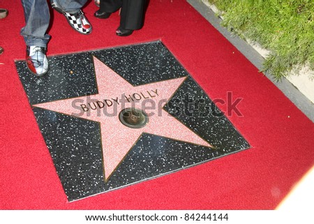 LOS ANGELES - SEPT 7:  Buddy Holly Star, with Gary Busey\'s feet at the Buddy Holly Walk of Fame Ceremony at the Hollywood Walk of Fame on September 7, 2011 in Los Angeles, CA