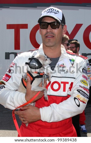 LOS ANGELES - APR 3:  Eddie Cibrian with assistance dog at the 2012 Toyota Pro/Celeb Race Press Day at Toyota Long Beach Grand Prix Track on April 3, 2012 in Long Beach, CA