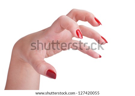 beautiful female hand with long red nails attacks isolated on white background