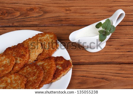 Potato pancakes with sour cream sauce and mint