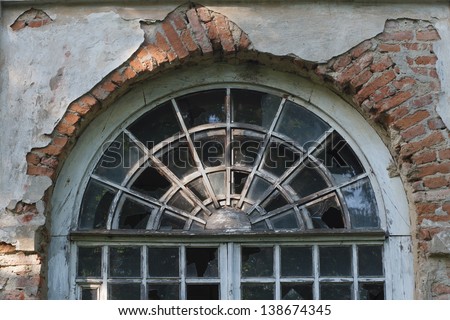 fragment of the old round window with broken windows
