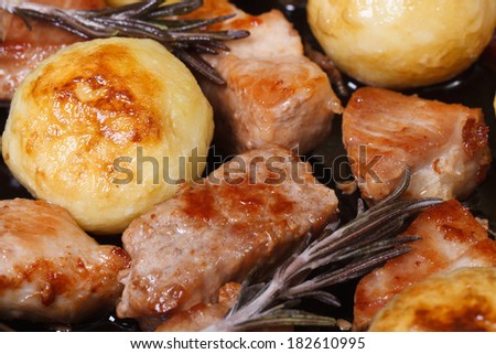 grilled meat and new potatoes closeup. view from above. horizontal. macro