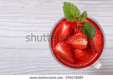 Delicious fresh strawberry drink with mint close up on the table top view