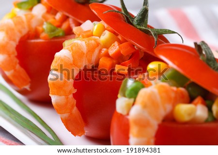 Fresh red tomatoes stuffed with vegetables and shrimp. macro. horizontal