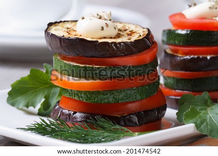 vegetarian appetizer of roasted vegetables with sauce closeup vertical