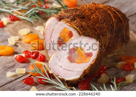 Pork meat with dried apricots, cherries and pineapple closeup. horizontal