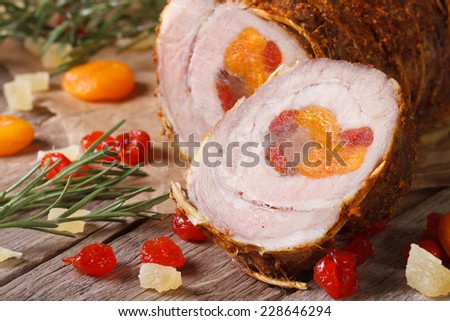 meat pork roll with apricot, cherry and pineapple closeup. horizontal