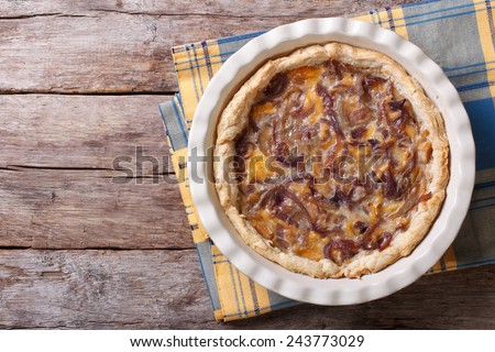 French onion tart in baking dish on the table. horizontal view from above