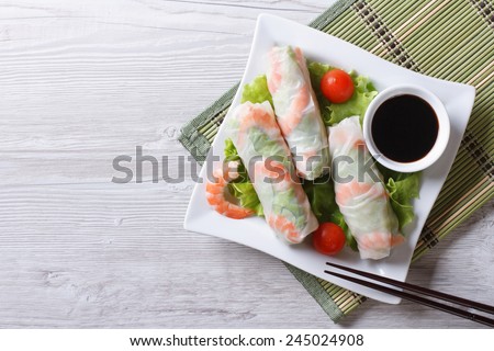spring roll with shrimp and vegetables on a plate. horizontal view from above