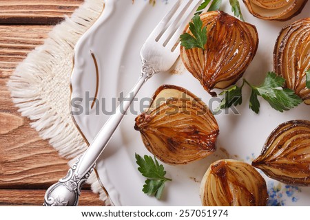 caramelized onions in balsamic vinegar on a white plate closeup. horizontal view from above
