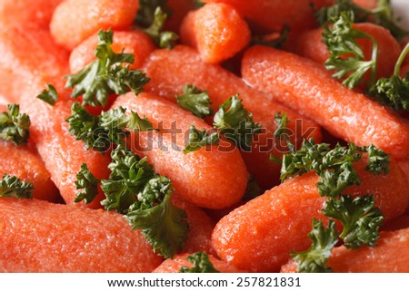 Glazed baby carrots with parsley macro. background, horizontal