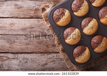 hot colorful cupcakes in a baking dish. horizontal view from above