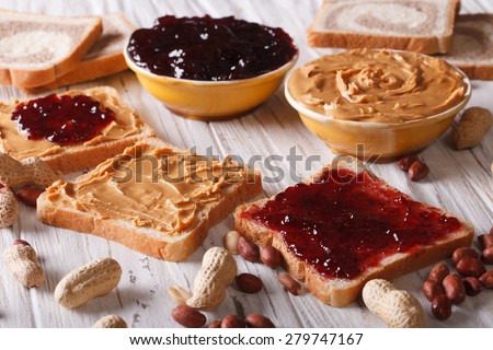 Sandwiches with peanut butter and jelly on the table. horizontal