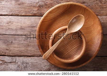 Wooden dish and spoon in a rustic style. horizontal view from above