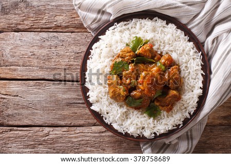 Indian food: Madras beef with basmati rice on the table. horizontal view from above