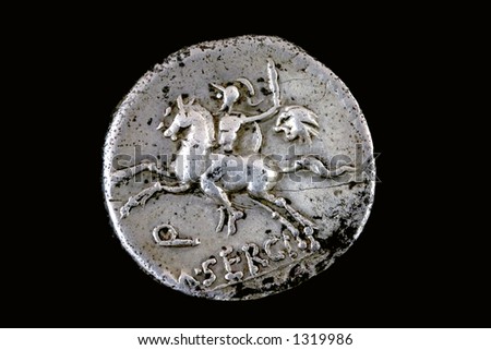 Roman republican denarius of M. Sergius Silus. 116 BC. A horseman is galloping   while holding a sword and the head of a barbarian in his left hand. Q M SERGI is below and SILVS is in the exergue.