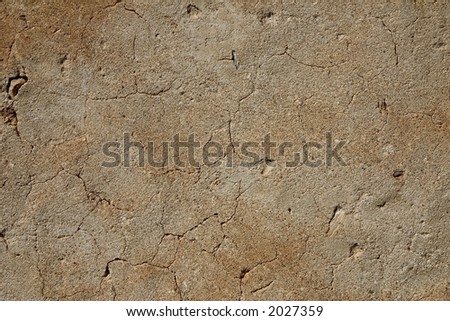 Close-up of an aged cracked wall; rough texture