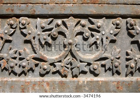 Detail of a decorated rusty metal gate