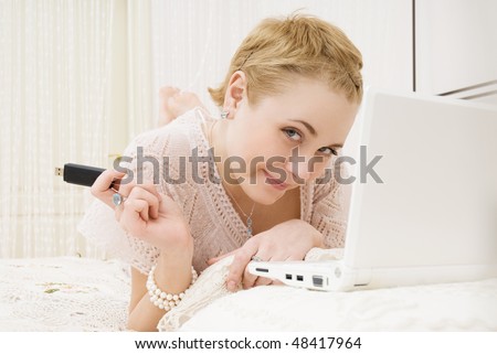 girl with memory card in bedroom