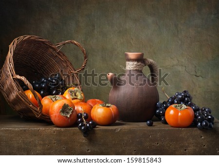 Still Life With Persimmons And Grapes On The Table