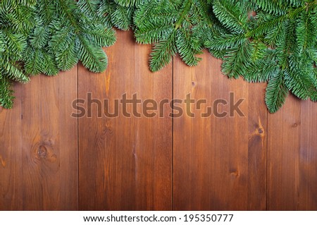 Fir branches on wooden boards