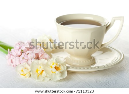Bouquet of flowers and a cup of tea