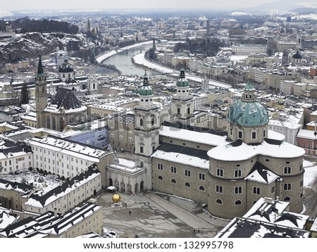 Aerial view of Salzburg: roofs covered in snow, view from the fortress