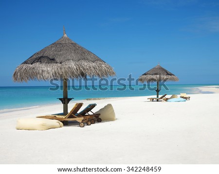 Maldives: islands in the indian ocean with white beaches, sun, blue sky, palm trees, amazing, clear blue water, sand. Perfect, relaxing, tropical holiday