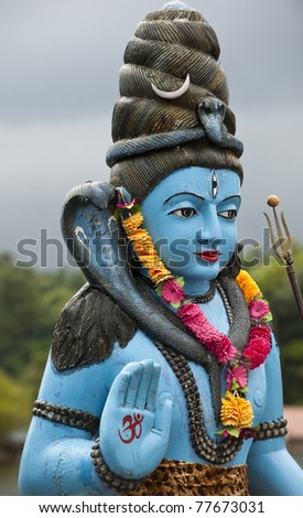 Statue of an indian (hindu, buddhist) divinity: Shiva  in a hindu temple (Grand Basin) in Mauritius