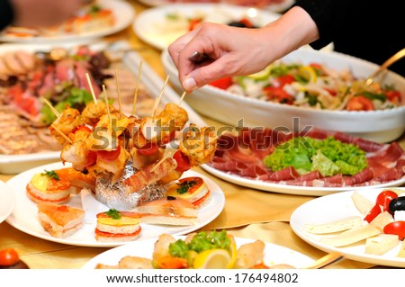 Human taking food on the party