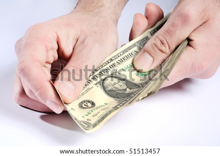 Dollars in hands, paying money