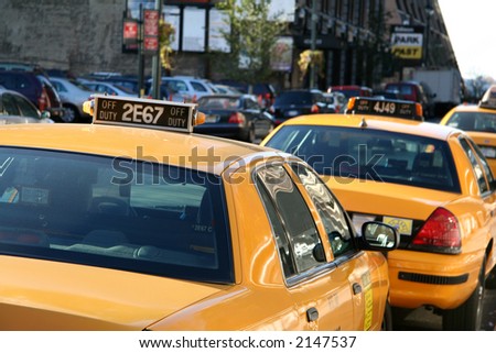 Parked Yellow Taxi Cab Waiting for a Fare