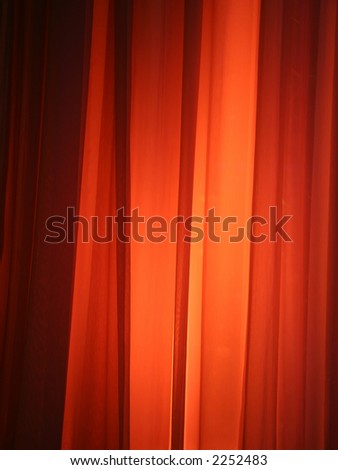 Spot Light Against Curtain Red Background Design