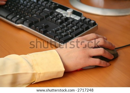 Woman Working on Computer Moving a Mouse