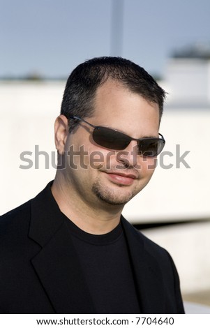 Casual Man with Sunglasses and Black Blazer Suit