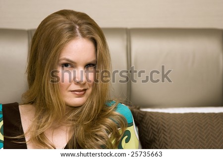 Attractive Young Woman with Serious Expression on Face