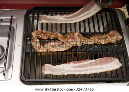 Crispy Bacon on Outdoor Grill for Breakfast