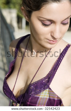 Woman in a Purple Dress Looking Down