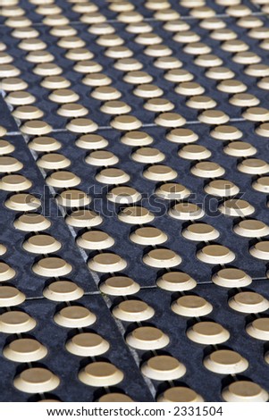 Background, Front Sharp, Back Blurred - Round Yellow Dots In Rows An A Bitumen Street Surface