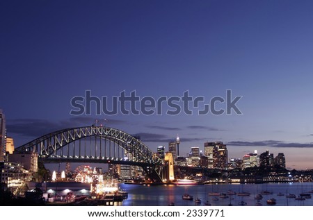 Sydney Harbour Bridge And City Skyline At Sunset, Australia
