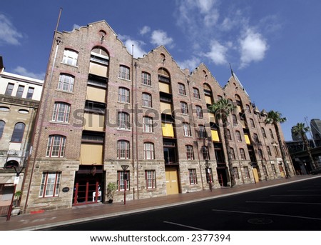 Apartment Building In Sydney, Australia - Blue Sky With Some Clouds, Wide-Angle Perspective