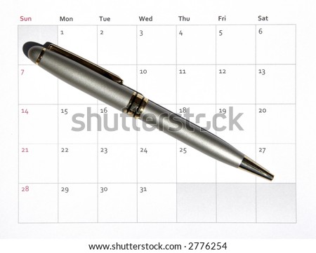 A Silver Pen Laying On A Paper Structure Monthly Business Calendar, Background