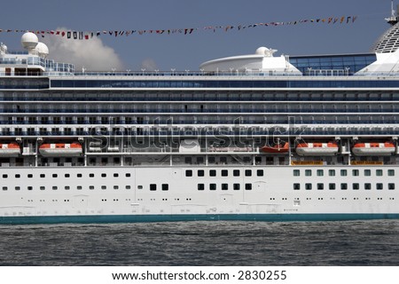 Center Part Of A Large White Cruise Ship, Cabins, Rescue Boats, Deck