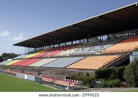 Many Empty Seats In Rows In An Outdoor Sports Stadium