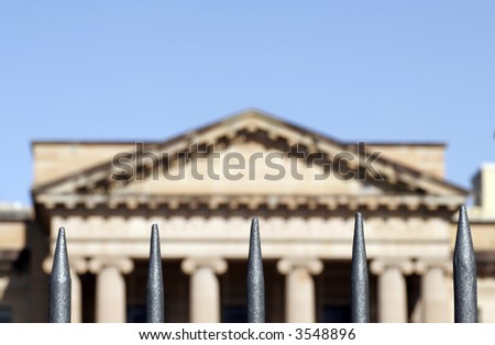 Classical Column Building Behind Metal Bars, Architecture