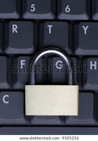 Closed Padlock On A Black Laptop Keyboard, IT Security Concept